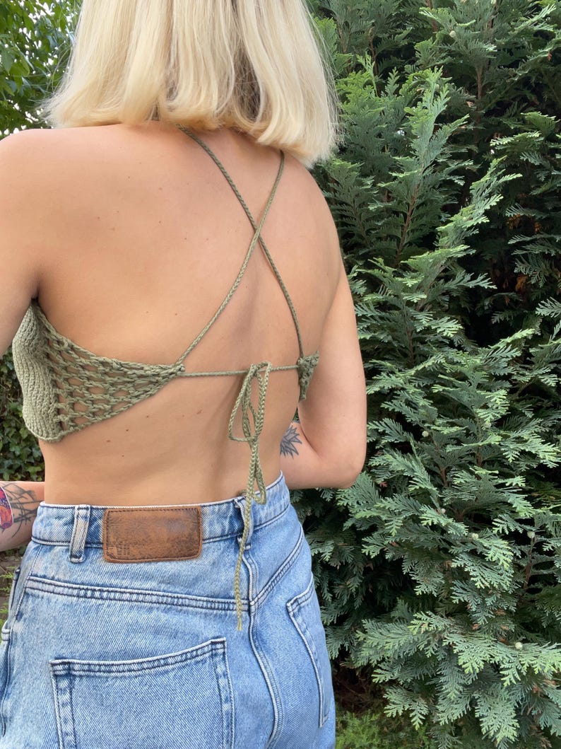 beginner friendly open back beach top crochet pattern. Lightweight summer blouse for beachwear, breathable backless cover-up for vacation or resort style, in Moss Green color from the back.