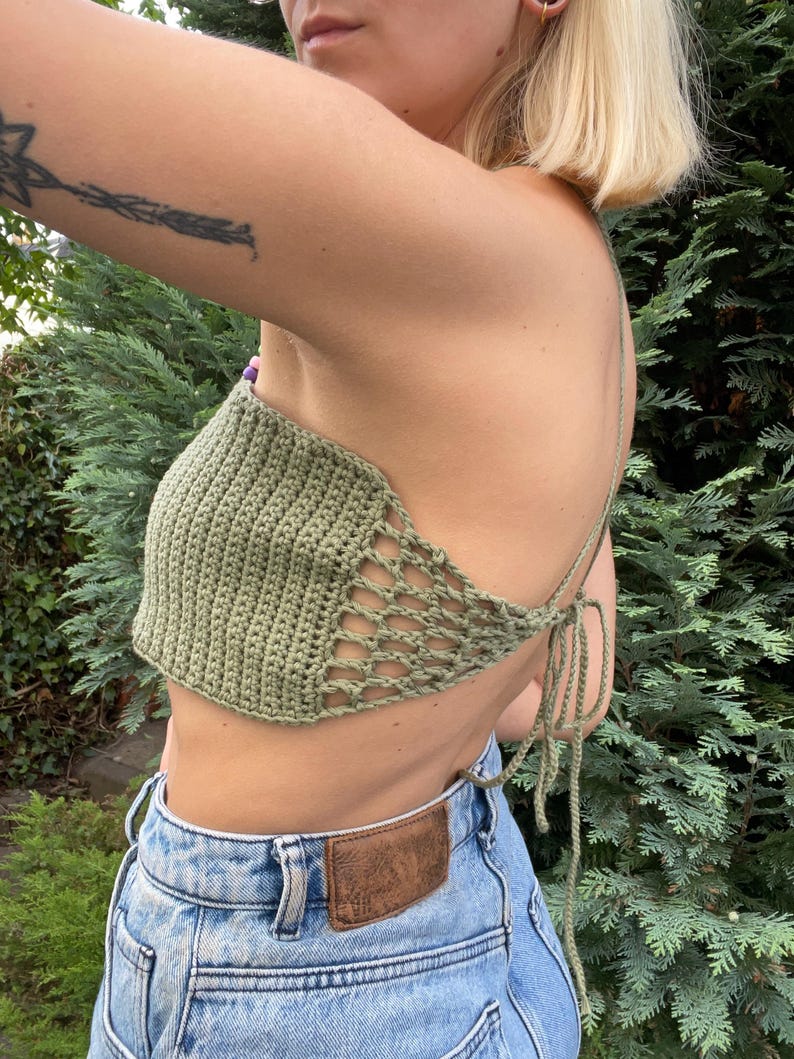 Women's open back beach top crochet pattern. Lightweight summer blouse for beachwear, breathable backless cover-up for vacation or resort style. Made from cotton in moss green color from the side.