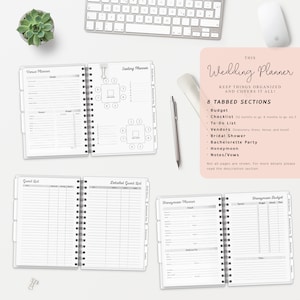 May include: A black and white wedding planner with 8 tabbed sections: Budget, Checklist, To-Do List, Vendors, Bridal Shower, Bachelorette Party, Honeymoon, and Notes/Vows. The planner has a spiral binding and is open to a page with a seating chart.