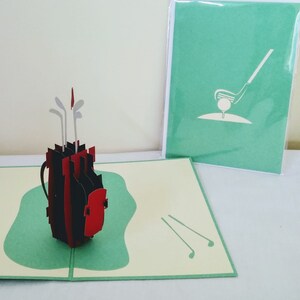 Palos de golf con pelota y bandera 3D Kirigami Tarjeta de felicitación emergente