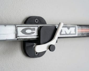 Soporte de pared para palo de hockey sobre hielo (juego de 2)