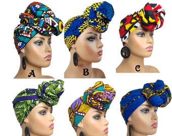 May include: Six different head wraps with colorful African print patterns. Each wrap is tied in a turban style on a mannequin head. The wraps are labeled A through F.