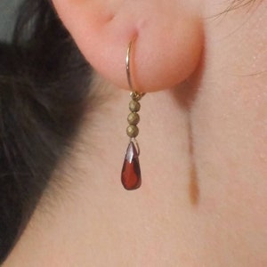 Small gold filled huggie hoop earrings with dainty gemstone drop charm dangles, natural red garnet and golden hematite crystal jewelry gift