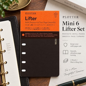 May include: A Plotter Mini 6 Lifter set featuring two black, rectangular refill protectors with four punched holes on the left side. The packaging is orange and black with the text Plotter Lifter, No 010, and Mini Size printed on the front.