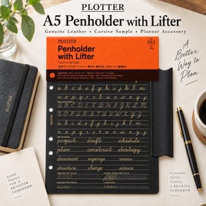 May include: A black A5 Plotter penholder with lifter featuring a bright orange header card. The surface displays gold cursive alphabet practice lines, word examples, and flow practice patterns. It includes punched holes for binding.