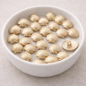 Botones náuticos dorados: estrella de mar, caracola, concha (10 unidades)