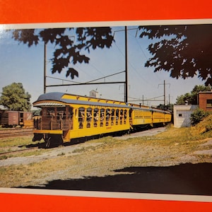 Carte postale du célèbre train jaune des chemins de fer de Strasbourg utilisée dans le film Hello Dolly
