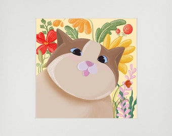 May include: A framed illustration of a white cat with brown patches, looking up with a pink nose and surrounded by colourful flowers on a yellow background.