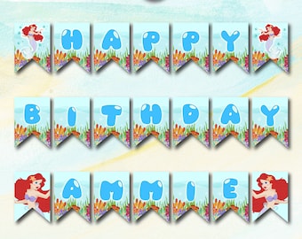 May include: A printable mermaid birthday banner with blue and white flags featuring the letters "HAPPY BIRTHDAY AMMIE" and a mermaid illustration on each flag.