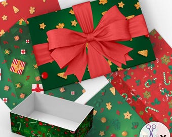 May include: A green and red Christmas gift box with a red bow and gingerbread cookie pattern. The box is open and the inside is empty. The box is surrounded by other Christmas wrapping paper with different patterns.