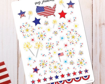 May include: A white sticker sheet titled my journal featuring red, white, and blue patriotic designs. Elements include a map of the United States, stars, fireworks, sparklers, and a small flag. A decorative scalloped border runs along the bottom.