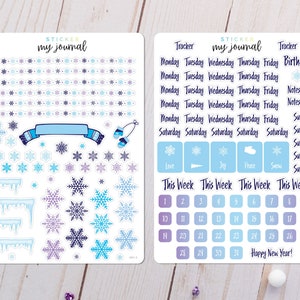 May include: Two sheets of stickers with a winter theme. The left sheet features snowflakes, icicles, a scarf, and mittens. The right sheet has a calendar, tracker, and the words "Love", "Joy", "Peace", "Snow", "Happy New Year!" and "This Week".