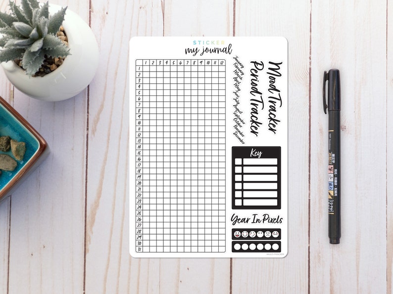 May include: A printable mood tracker sticker sheet for a journal. The sheet has a grid for tracking moods over a month, a key for mood tracking, and a section for tracking your year in pixels.