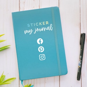 May include: A teal blue journal with the text "STICKER my journal" and social media icons for Facebook, Pinterest, and Instagram.