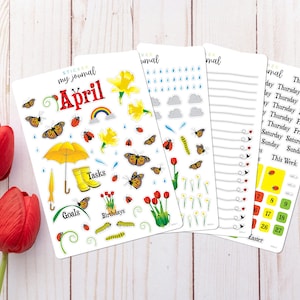 A set of four sticker sheets for a journal. The stickers feature a variety of spring-themed designs, including flowers, butterflies, ladybugs, rain clouds, raindrops, umbrellas, and a rainbow. The stickers are labeled with the words 'April', 'Tasks', 'Goals', and 'Birthdays'. Includes days of the week stickers and date dots for a full month. Primary color theme is red and yellow with bright green. The sheets are designed for use in a journal or planner.