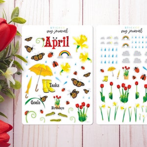 May include: Two sheets of stickers for a planner or journal. The stickers are themed for the month of April and feature butterflies, flowers, rain clouds, raindrops, a yellow umbrella, rain boots, and the words "My Journal, April, Goals, Tasks, Birthdays".