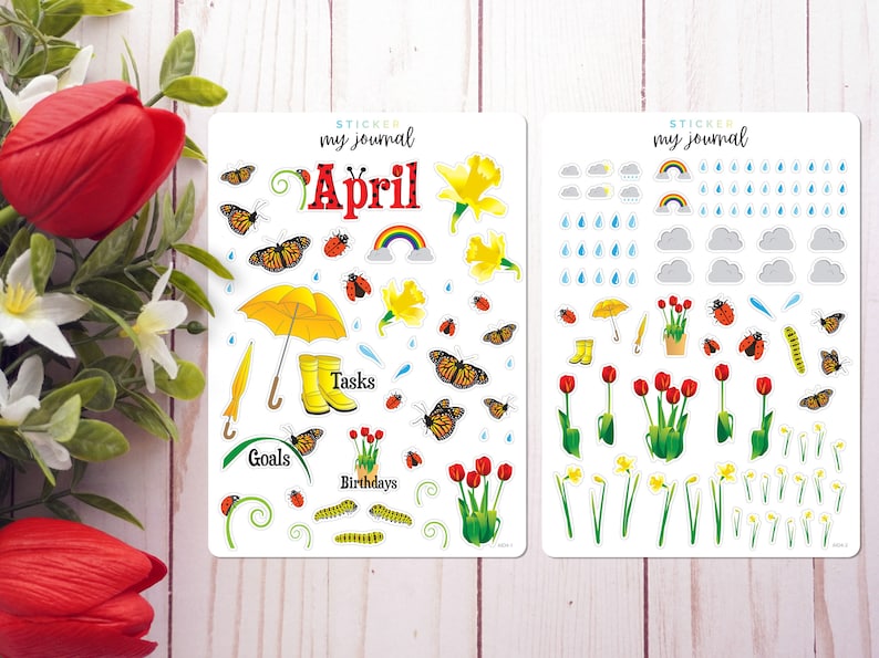 May include: Two sheets of stickers for a planner or journal. The stickers are themed for the month of April and feature butterflies, flowers, rain clouds, raindrops, a yellow umbrella, rain boots, and the words "My Journal, April, Goals, Tasks, Birthdays".