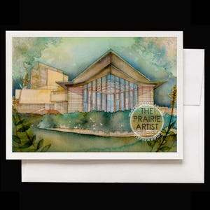 May include: Watercolor art print of a modern building with a triangular roof and large glass windows. The artwork features a palette of greens, blues, and beige, with the text "The Prairie Artist" and artist's name. The print is on a white card.