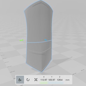 May include: A 3D model of a gray shield with a slightly curved top and a pointed bottom. The shield is 113.97 mm wide, 105.97 mm tall, and 139.4 mm deep.