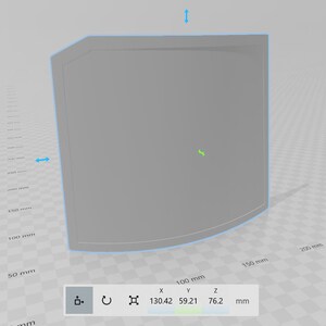 May include: A 3D model of a gray, rectangular object with rounded edges. The object is 130.42 mm wide, 59.21 mm high, and 76.2 mm deep.