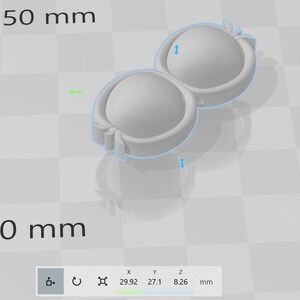 May include: A 3D printed model of a figure eight shape with a smooth, white finish. The model is approximately 2.99 inches wide, 2.71 inches long, and 0.83 inches tall.