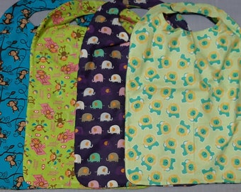 Reversible Large Adult or Handicapped Clothes Protectors: Jungle Animals on flannel with More Jungle Animals on fleece on the other side.