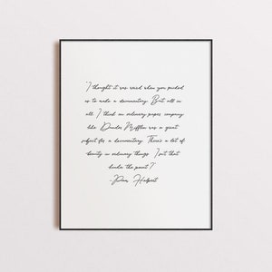 May include: A black and white print of a quote from the TV show "The Office" by Pam Beesly. The quote reads: "I thought it was weird when you picked us to make a documentary. But all in all, I think an ordinary paper company like Dunder Mifflin was a great subject for a documentary. There's a lot of beauty in ordinary things. Don't that kinda the point?" -Pam Halpert
