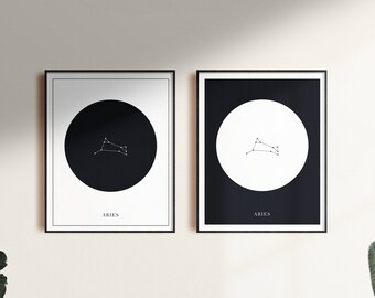 May include: Two framed art prints featuring the Aries constellation. One print has a white background with a black circle and constellation, the other has a black background with a white circle and constellation. The word "ARIES" is printed at the bottom.