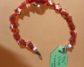 7 1-2” glowing orange star bracelet