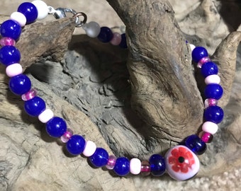7.5 sapphire blue bracelet with round center flower bead