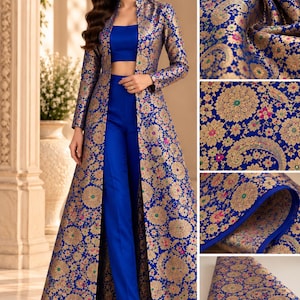 May include: A royal blue three-piece set consisting of a sleeveless crop top, high-waisted trousers, and a long-sleeved floor-length duster coat. The coat features an intricate gold floral brocade pattern with small pink and green accents.