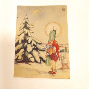 Vintage-Postkarte Ende der 40er Jahre. Gedruckt in Berlin, Deutschland. Junge, Weihnachten, Winter, Kerze