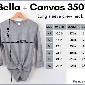 Peut inclure: Un t-shirt gris &agrave; manches longues et col rond avec un tableau des tailles indiquant les mesures en pouces. Le tableau comprend les tailles XS, S, M, L, XL et 2X. Le texte "Bella + Canvas 3501" et "Fits true to size" est &eacute;galement visible.