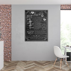 May include: A black and white chalkboard sign with a recipe for a happy marriage. The recipe includes ingredients like genuine love, true friendship, happy thoughts, mutual respect, and understanding. The sign is framed in a black frame and hangs on a brick wall.