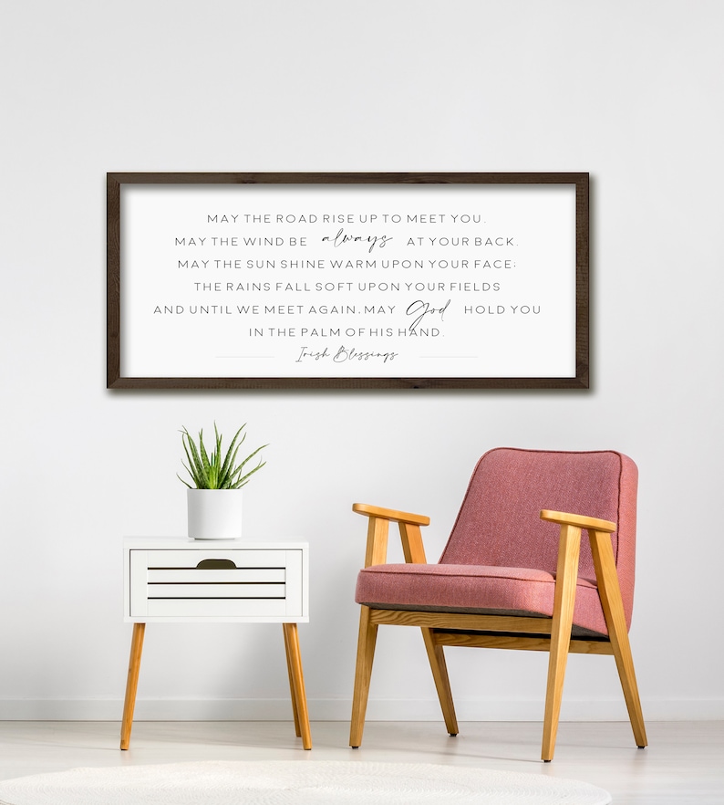 May include: A framed print with a white background and black text. The text reads: "May the road rise up to meet you. May the wind be always at your back. May the sun shine warm upon your face: The rains fall soft upon your fields and until we meet again. May God hold you in the palm of his hand. Irish Blessings."