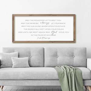 May include: A framed print with a white background and black text. The text reads: "May the road rise up to meet you. May the wind be always at your back. May the sun shine warm upon your face. The rains fall soft upon your fields. And until we meet again, may God hold you in the palm of His hand. Irish Blessings."