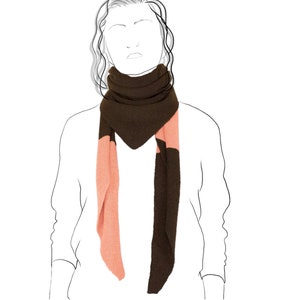 May include: A brown and pink scarf with a triangular shape. The scarf is folded and worn around the neck.