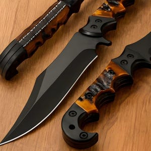 May include: Three black knives with unique handles are displayed on a wooden surface. The blades are black and sharp, while the handles feature a marbled pattern in shades of brown and orange. The knives vary in size and design, showcasing a blend of functionality and aesthetics.