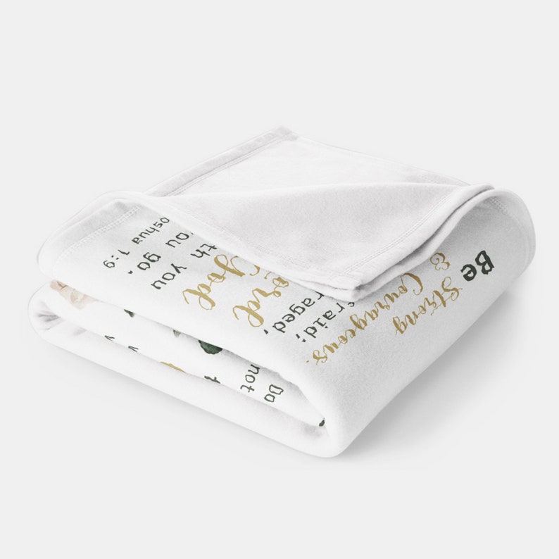 May include: White fleece blanket with a gold floral design and the text "Be Strong & Courageous. Do not be afraid; God is with you.  Joshua 1:9."