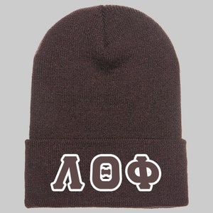 May include: Brown knit beanie with a white embroidered Greek letter design that reads "ΛΘΦ".
