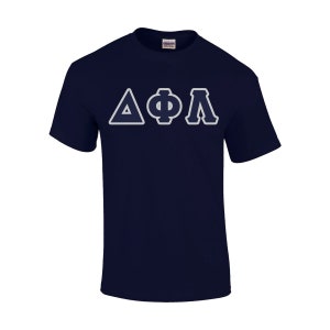 May include: Navy blue t-shirt with the Greek letters Delta, Phi, and Lambda in a white and light blue design. The shirt is made of a soft material and has a crew neck. The Gildan logo is visible on the back of the neck.