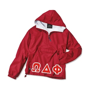 May include: Red hooded pullover jacket with a white lining and a large white "ΩΔΦ" logo on the front.