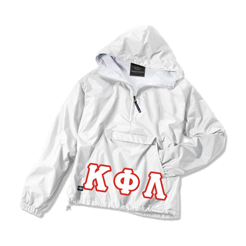May include: White hooded anorak jacket with a front pocket and a half-zip closure. The jacket features the Greek letters K&Phi;&Lambda; in red block letters on the lower front. The jacket has a drawstring at the bottom hem and a small tag on the lower left.