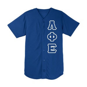 May include: A royal blue baseball jersey with short sleeves and a button-down front. The jersey features the Greek letters ΛΦΕ in white, outlined in blue, vertically down the left side.