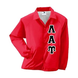 May include: Red windbreaker jacket with black lettering that reads "ΛΑΑΤ".