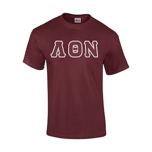 May include: A maroon t-shirt with white lettering that reads "ΛΘΝ".