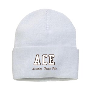 May include: A white beanie with a folded brim. The word "ACE" is printed in a brown, block letter font, with the words "Lambda Theta Phi" printed below it. The beanie is made of a soft, knitted material.