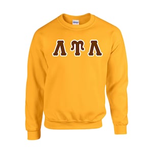 May include: A yellow sweatshirt with brown lettering that reads "&Alpha;&Gamma;&Lambda;".