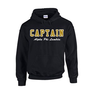 May include: Black hooded sweatshirt with the text "CAPTAIN Alpha Phi Lambda" in gold lettering.