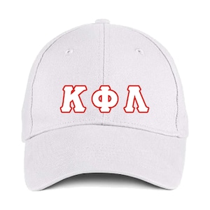 May include: White baseball cap with the Greek letters ΚΦΛ in red, outlined in white. The cap has a curved brim and a button on top. This hat is a classic accessory.